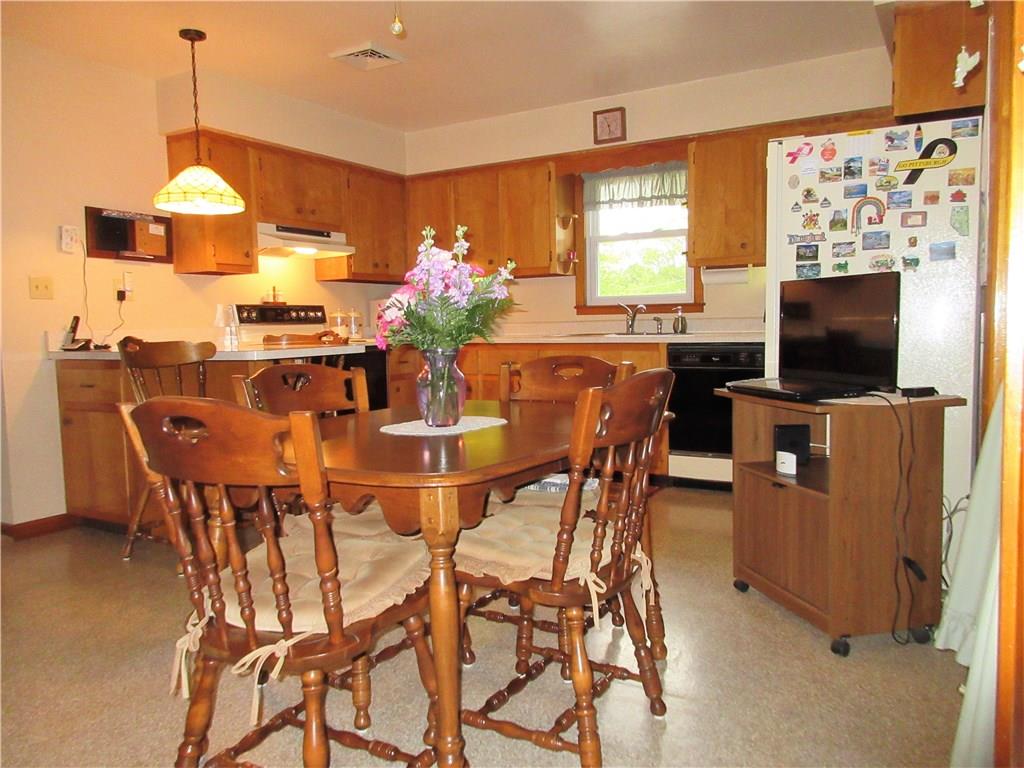 182 Ford City Road Freeport, PA 16229 - Photo 5 of 24 Spacious eat-in kitchen offers plenty of counter space, includes appliances, and opens to the living room, as well as the enclosed sunroom.