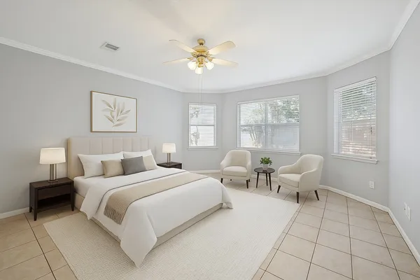 a bedroom with a bed and a couch