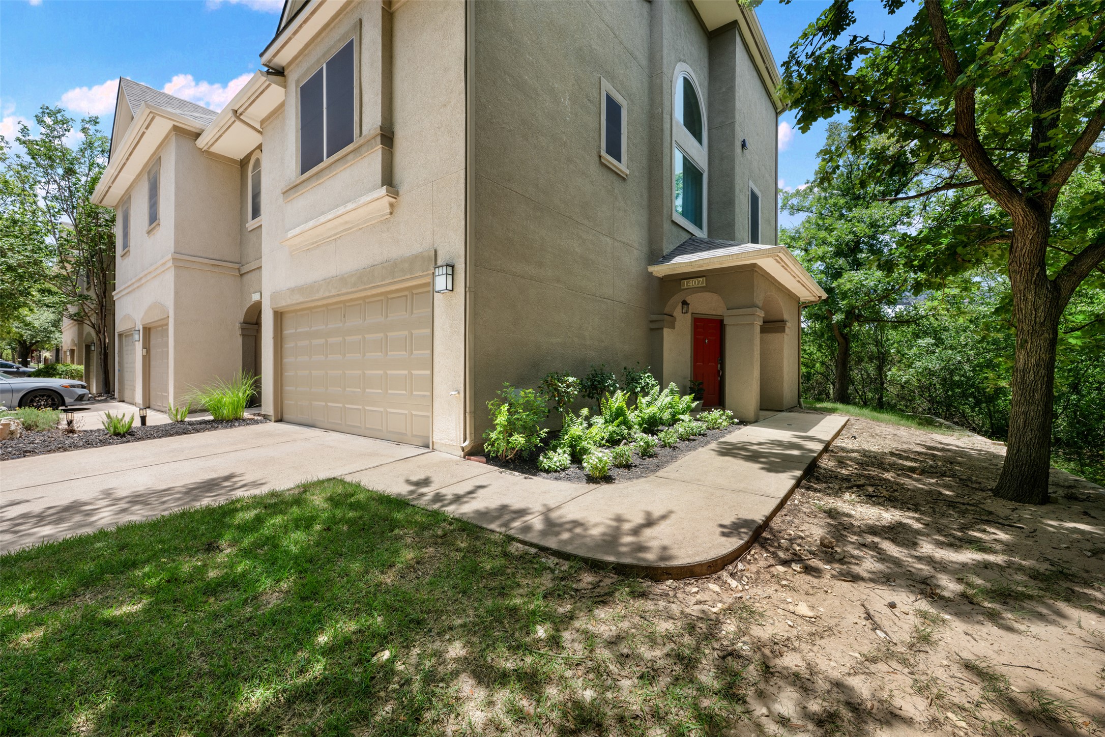 11203 Ranch Road 2222, Unit 1407 Austin, TX 78732 - Photo 7 of 40 One of, if not the most sought after units in the complex, this end of cul-de-sac townhome sits alongside the greenbelt and offers a private entrance and two car garage.