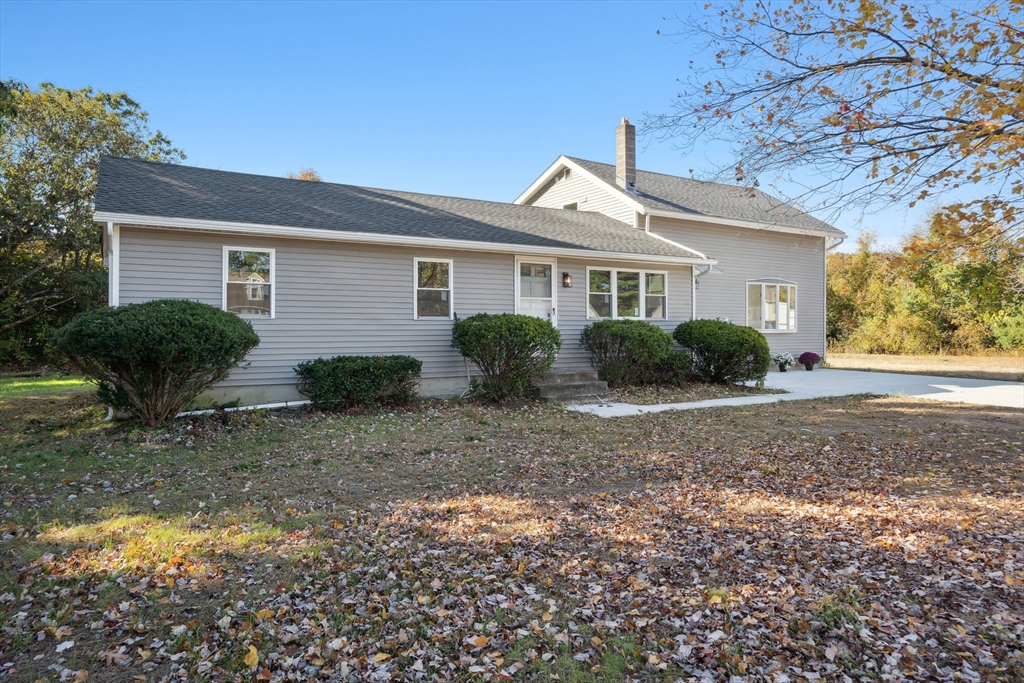 154 County Road Southampton, MA 01073 - Photo 2 of 42 a view of a yard in front of a house with plants and large tree
