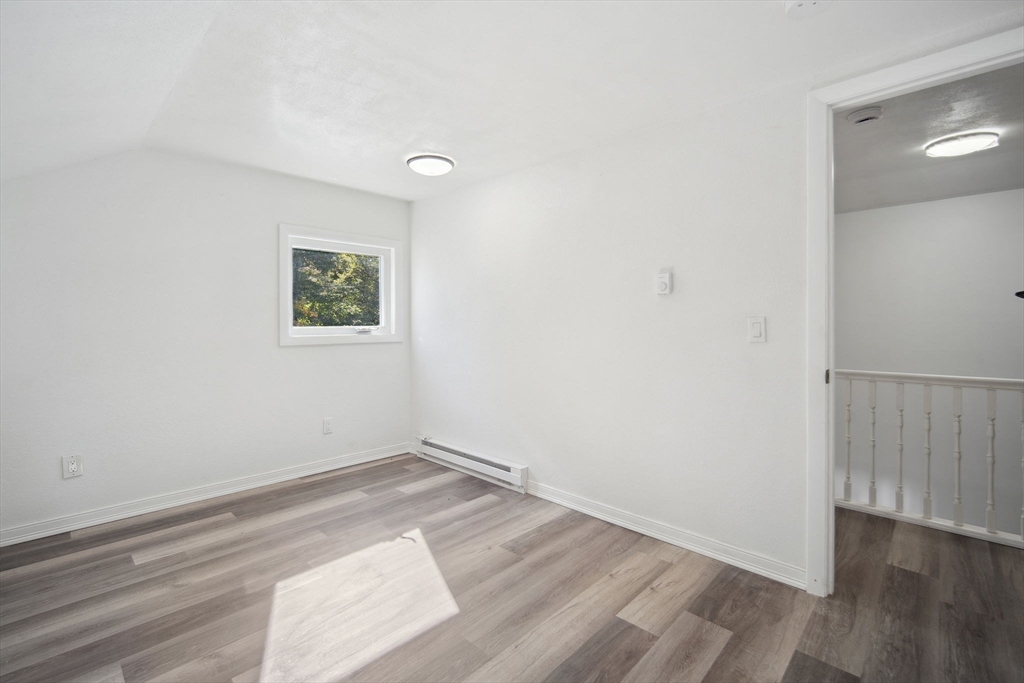 154 County Road Southampton, MA 01073 - Photo 34 of 42 an empty room with wooden floor and windows