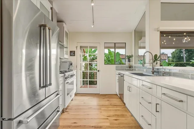 a view of balcony with wooden floor and fence