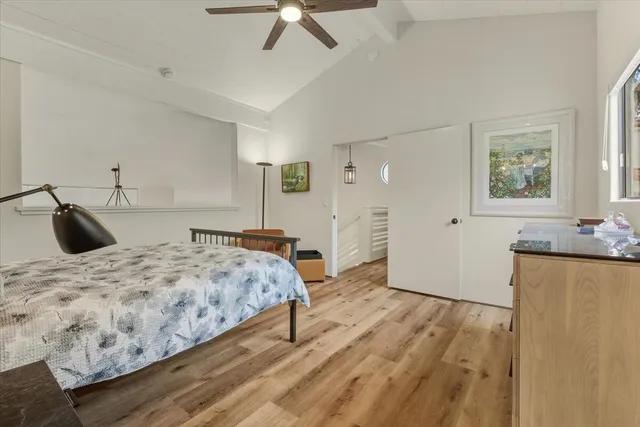 a white bath tub sitting next to a shower