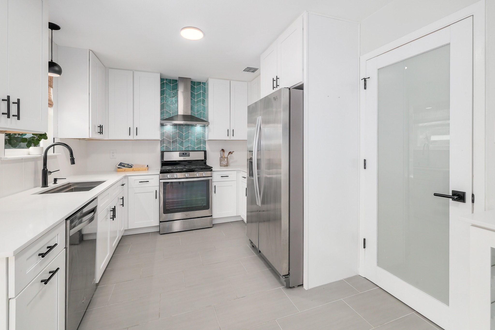 9614 Chukar Circle Austin, TX 78758 - Photo 2 of 26 Gorgeous modernized kitchen with desirable contemporary updates for the home chef.