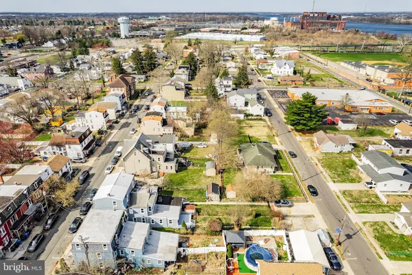 an aerial view of residential building and lake