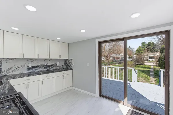 a kitchen with a sink and large window