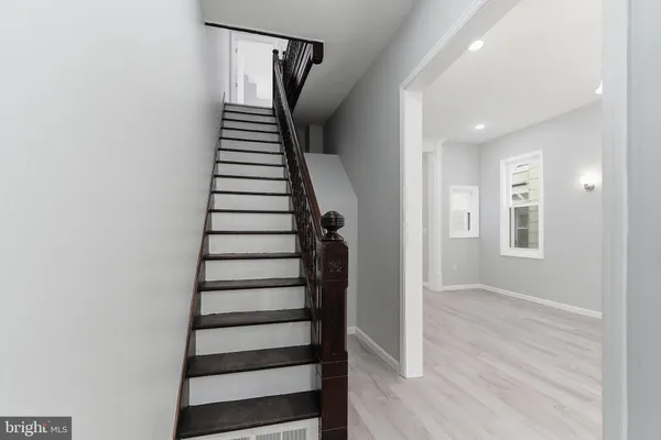 a view of entryway with wooden floor