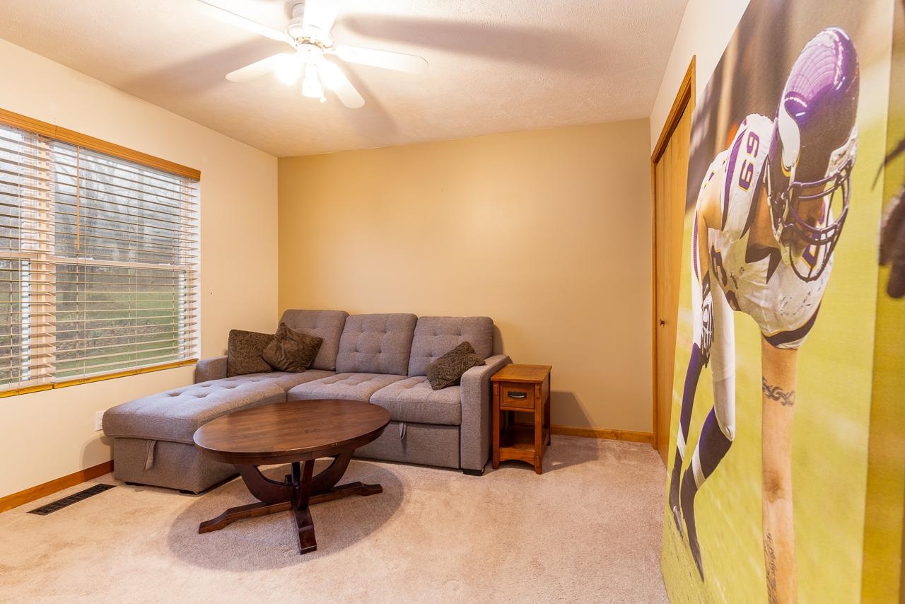 643 Knollwood Road Davis, IL 61019 - Photo 13 of 26 a living room with furniture and a window