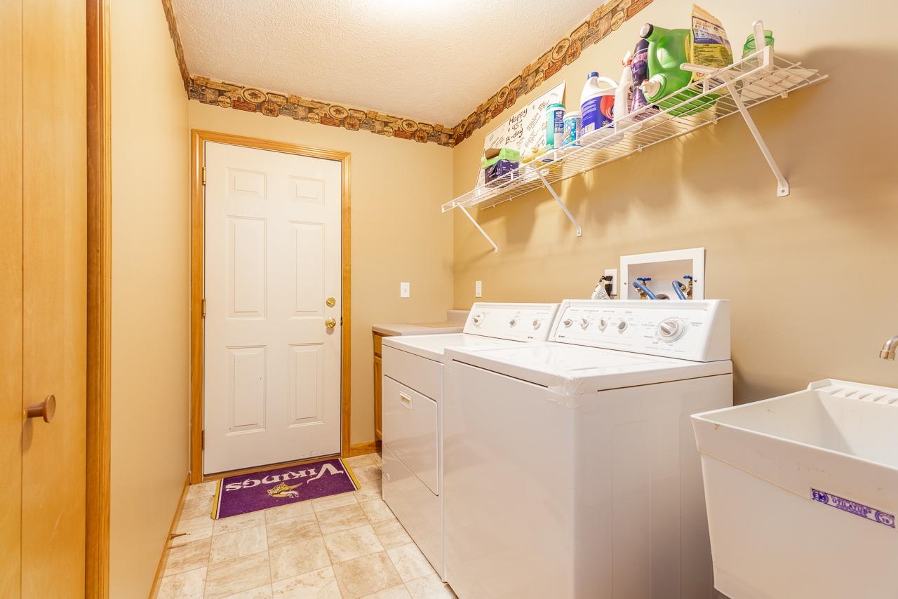 643 Knollwood Road Davis, IL 61019 - Photo 14 of 26 a utility room with dryer and washer