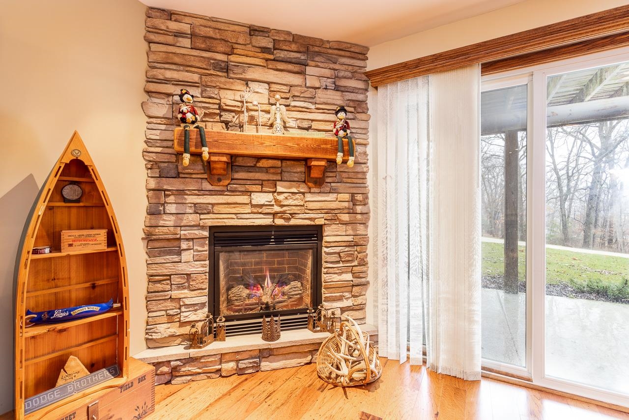 643 Knollwood Road Davis, IL 61019 - Photo 16 of 26 a view of a fireplace and window in a room