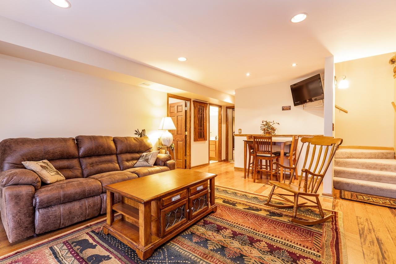 643 Knollwood Road Davis, IL 61019 - Photo 17 of 26 a living room with furniture and a flat screen tv