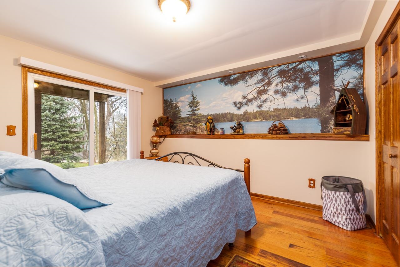 643 Knollwood Road Davis, IL 61019 - Photo 18 of 26 a bedroom with a bed and window
