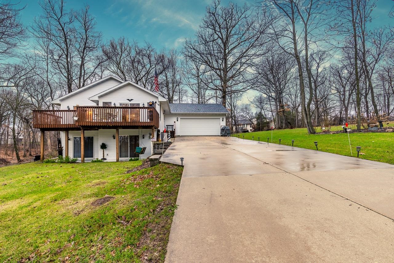 643 Knollwood Road Davis, IL 61019 - Photo 22 of 26 a front view of a house with a yard and trees