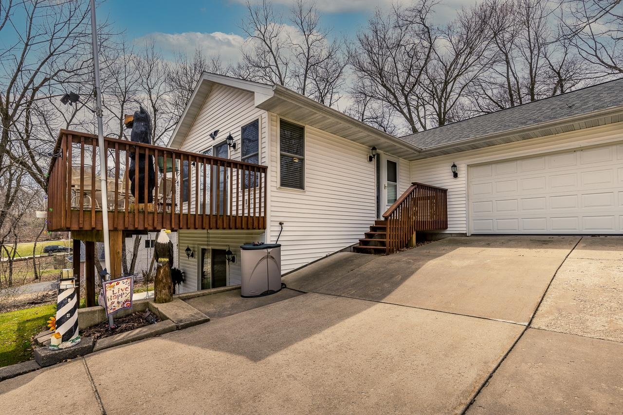 643 Knollwood Road Davis, IL 61019 - Photo 23 of 26 a view of a house with a patio and backyard