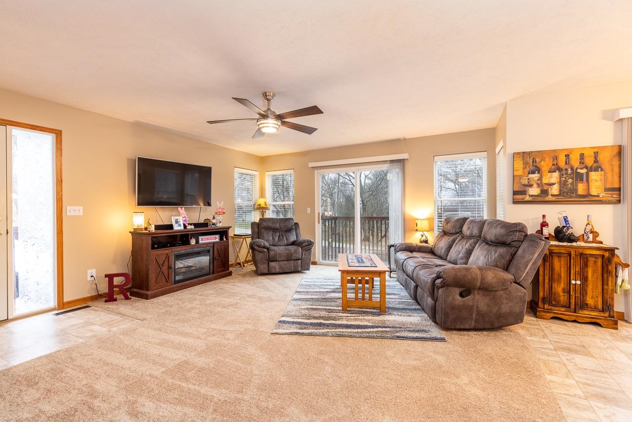 643 Knollwood Road Davis, IL 61019 - Photo 4 of 26 a living room with furniture and a flat screen tv