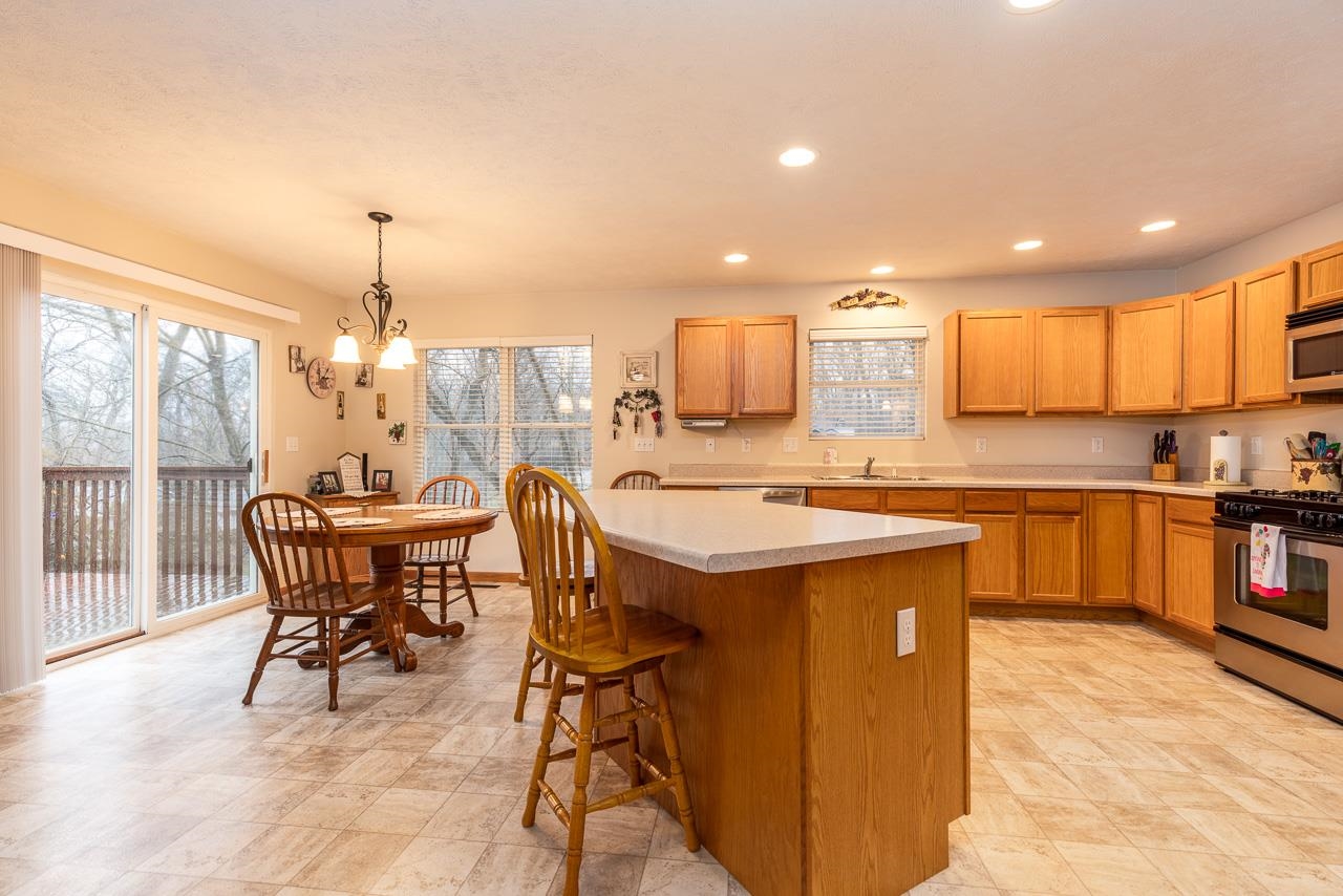 643 Knollwood Road Davis, IL 61019 - Photo 5 of 26 a kitchen with a table chairs sink and cabinets