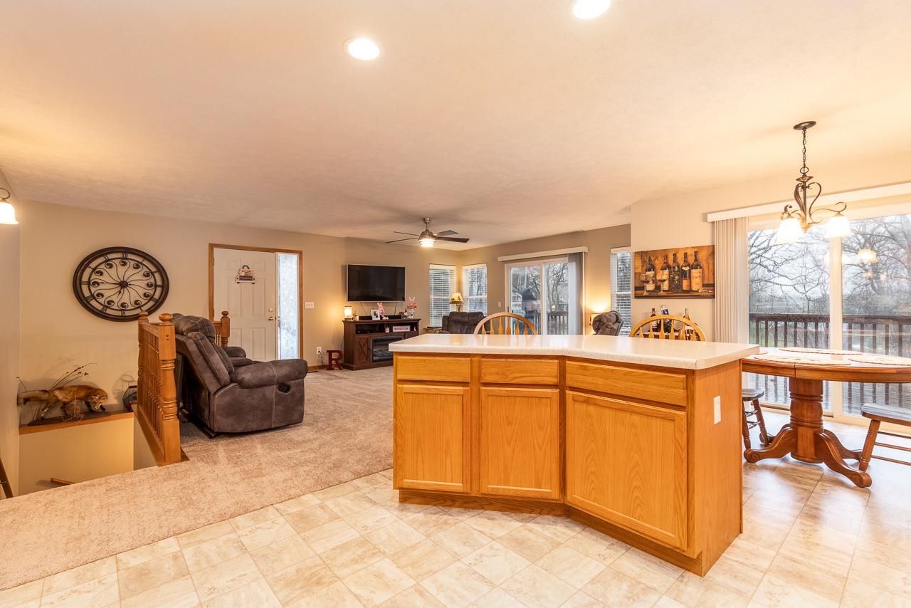 643 Knollwood Road Davis, IL 61019 - Photo 7 of 26 a very nice looking living room with a large window and kitchen view