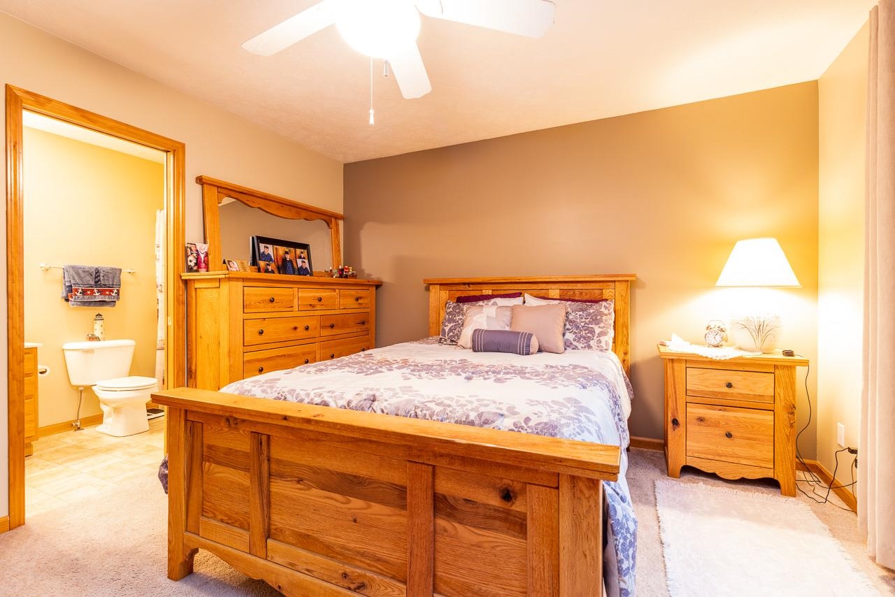 643 Knollwood Road Davis, IL 61019 - Photo 10 of 26 a bedroom with a bed and cabinets