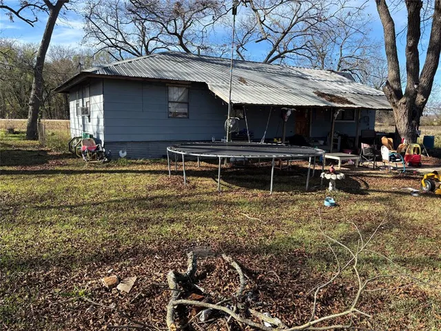 a view of a chairs and table in the patio