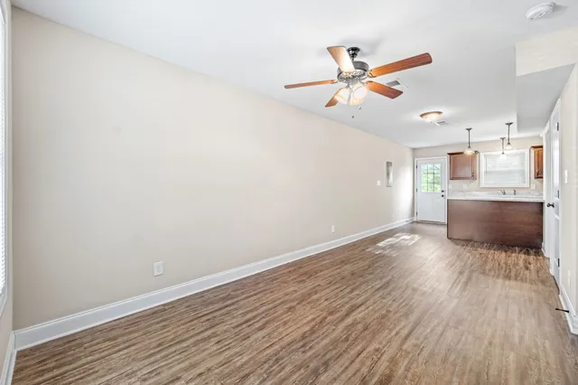 a view of workspace with wooden floor and window