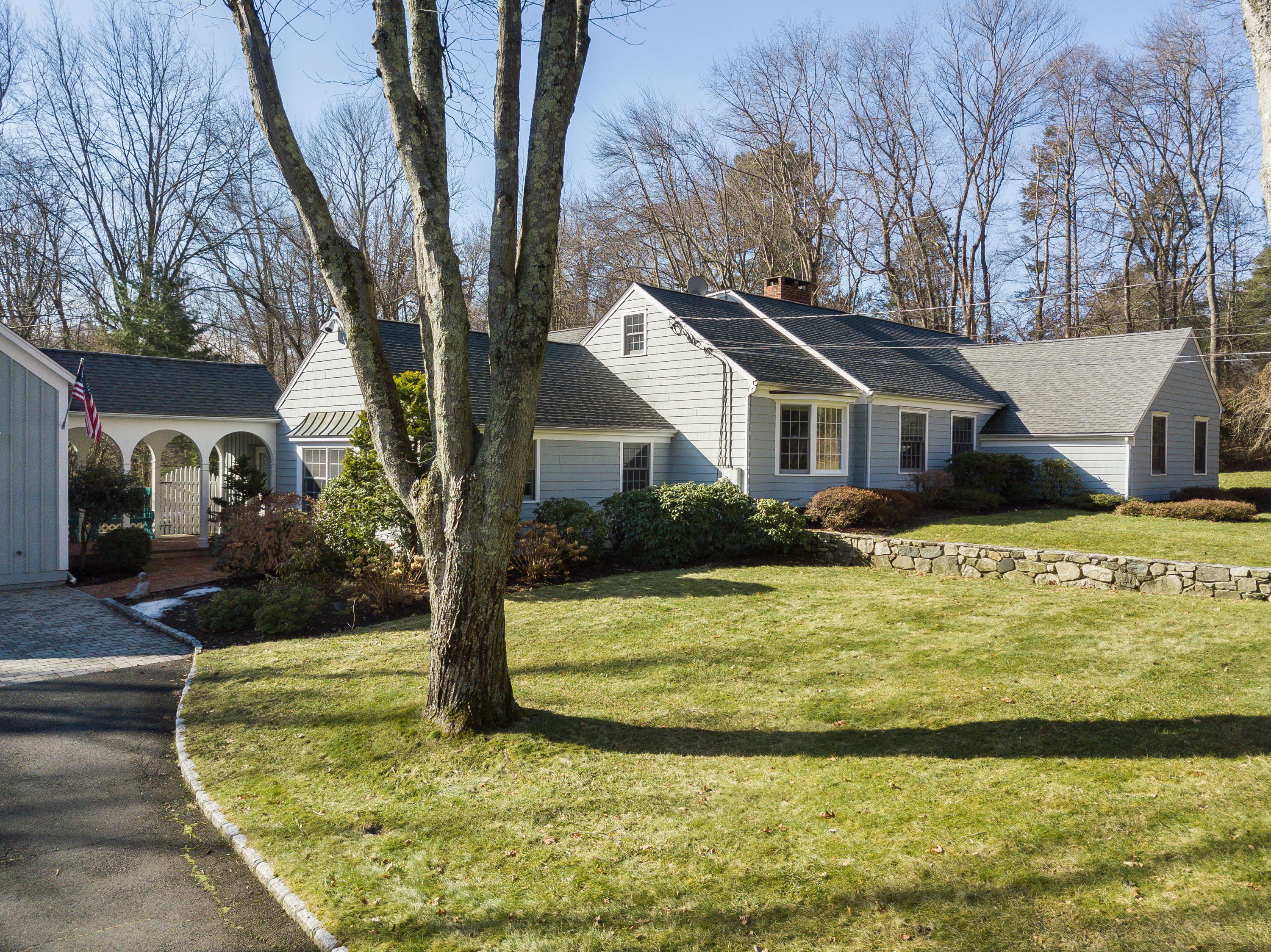 8 Priscilla Lane Darien, CT 06820 - Photo 16 of 37 a view of a house with swimming pool and a yard