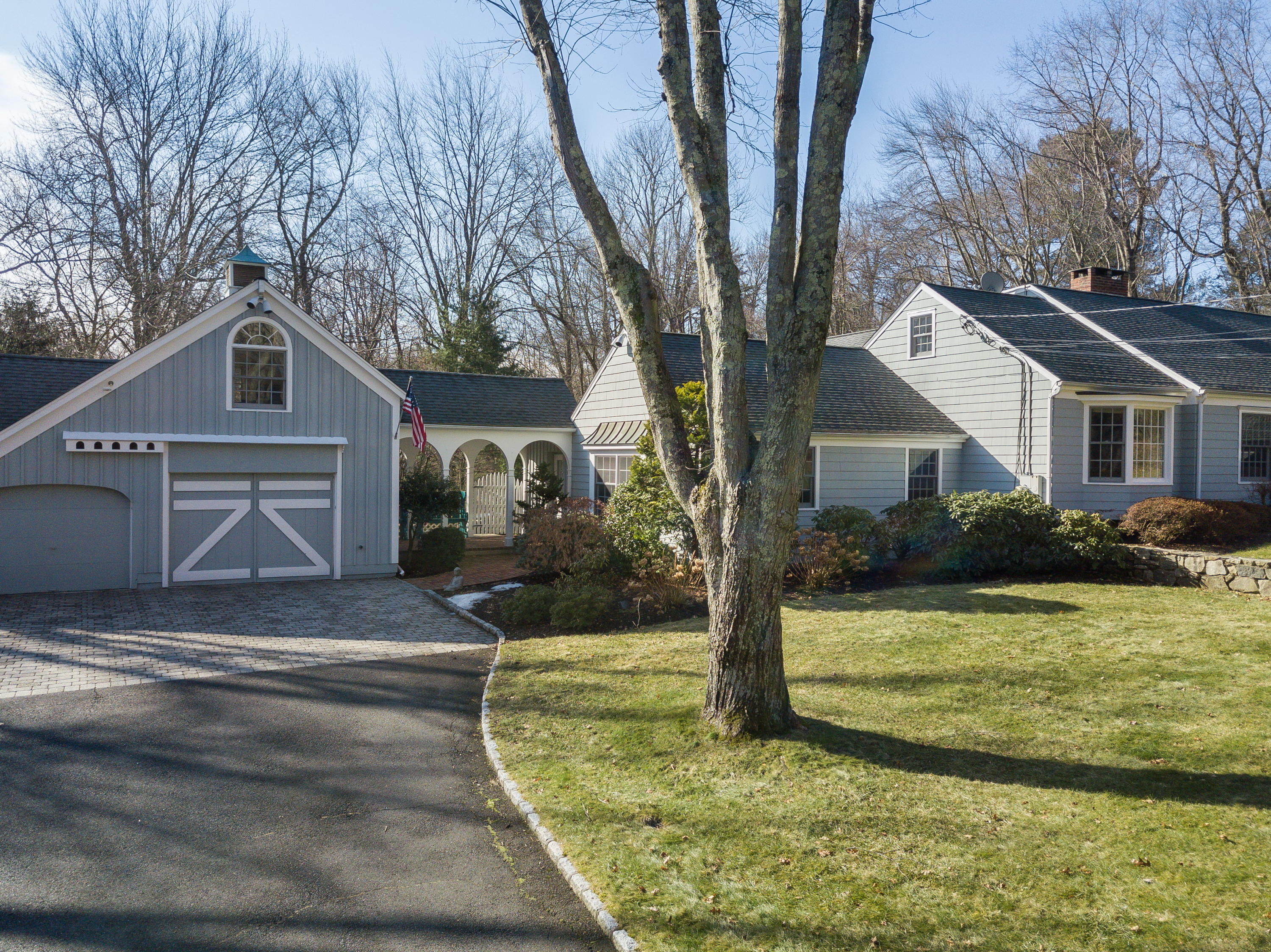 8 Priscilla Lane Darien, CT 06820 - Photo 17 of 37 a front view of a house with a yard