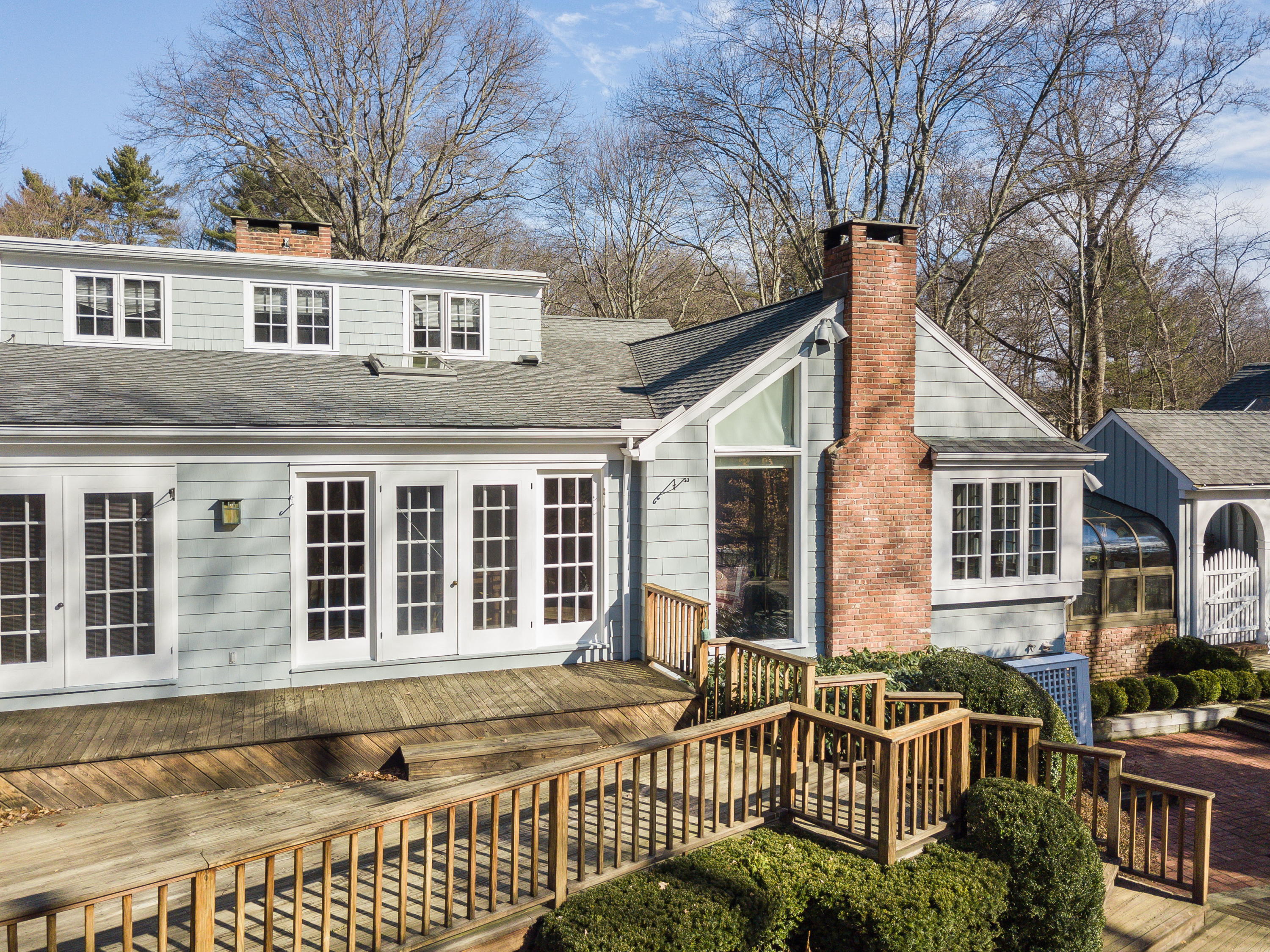 8 Priscilla Lane Darien, CT 06820 - Photo 20 of 37 a view of a brick house with large windows