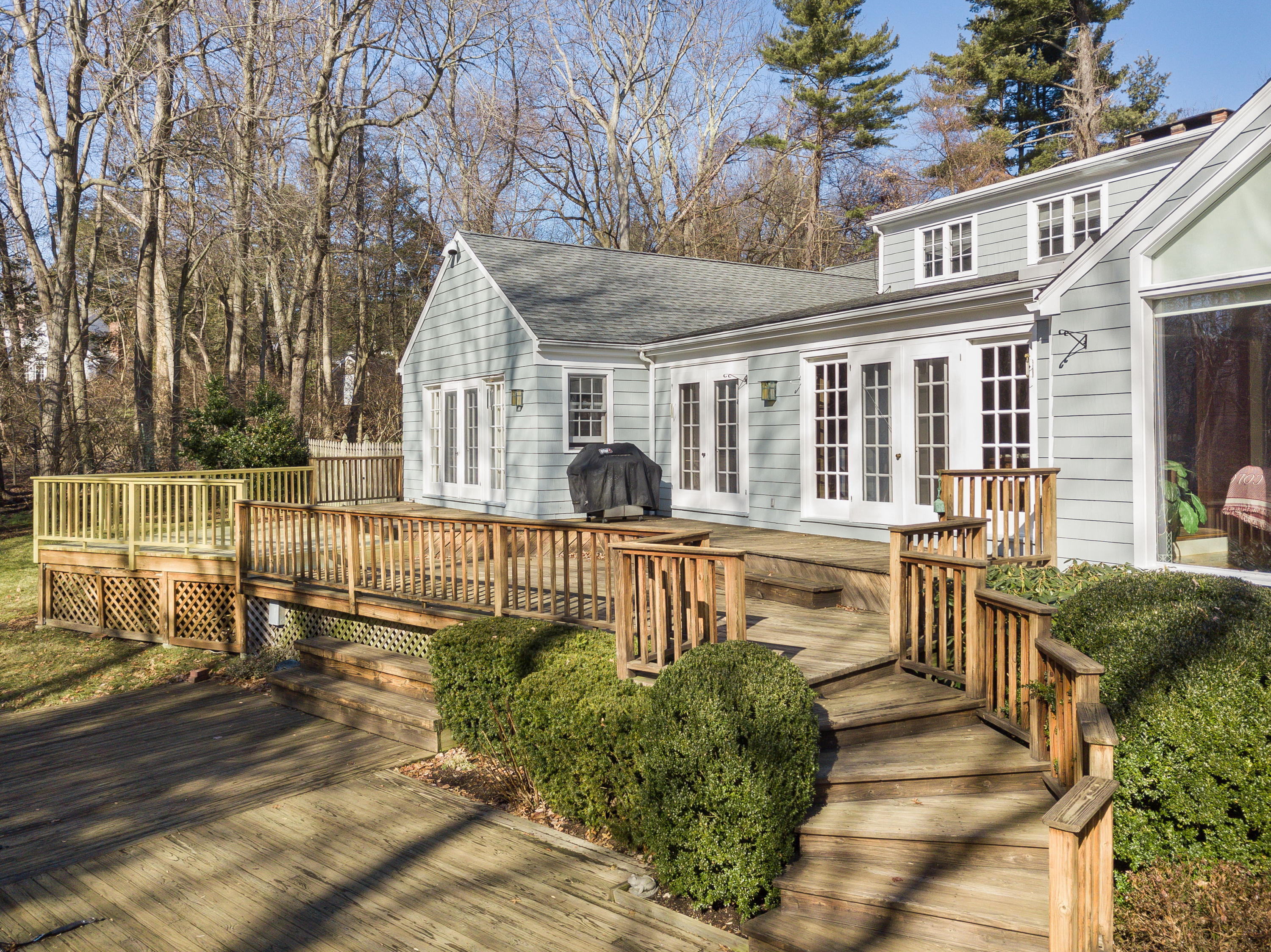 8 Priscilla Lane Darien, CT 06820 - Photo 22 of 37 a front view of a house with a garden