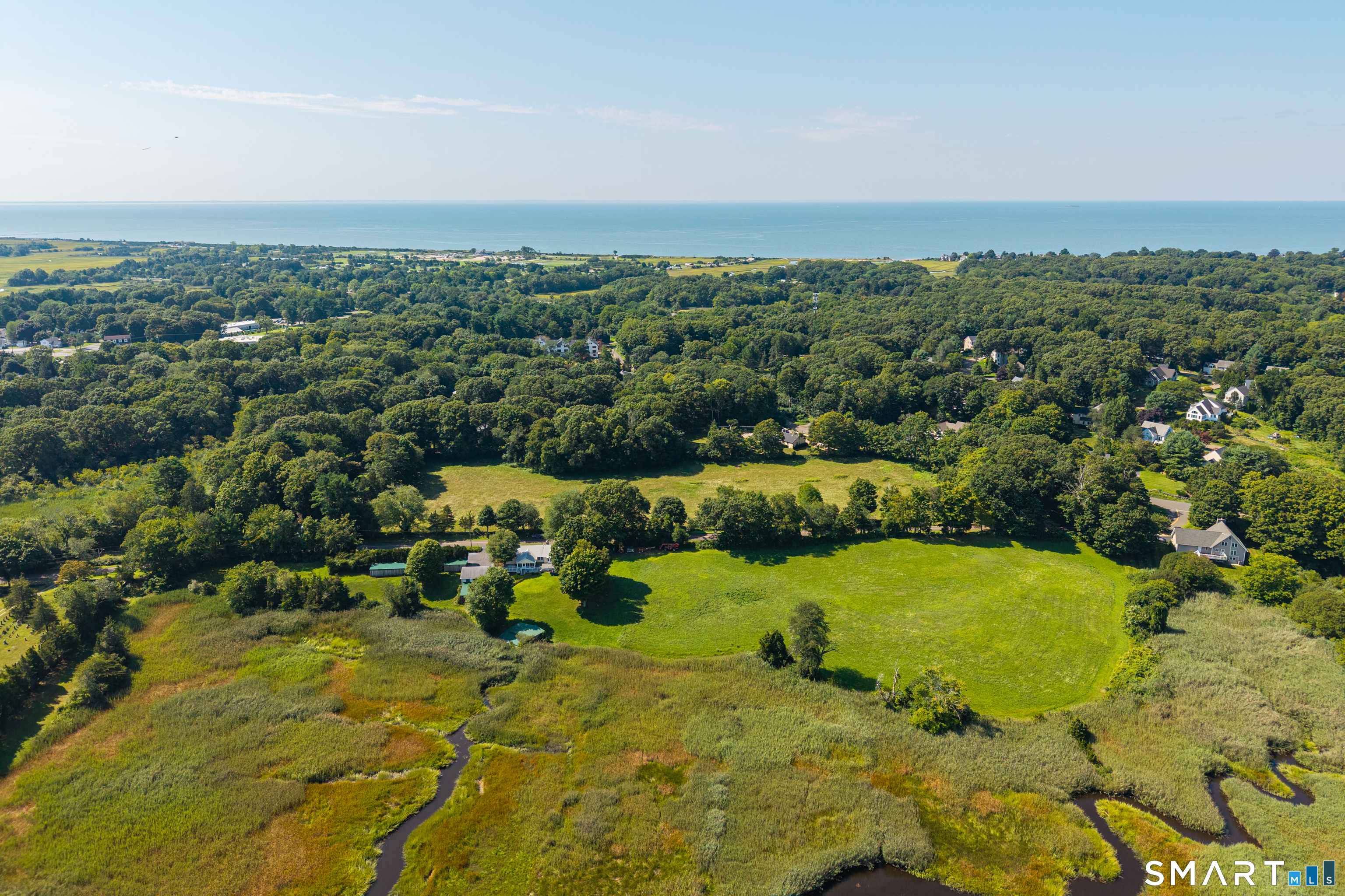 118 River Road Madison, CT 06443 - Photo 11 of 25 An aerial from the river side showing Long Island Sound and beaches close by.