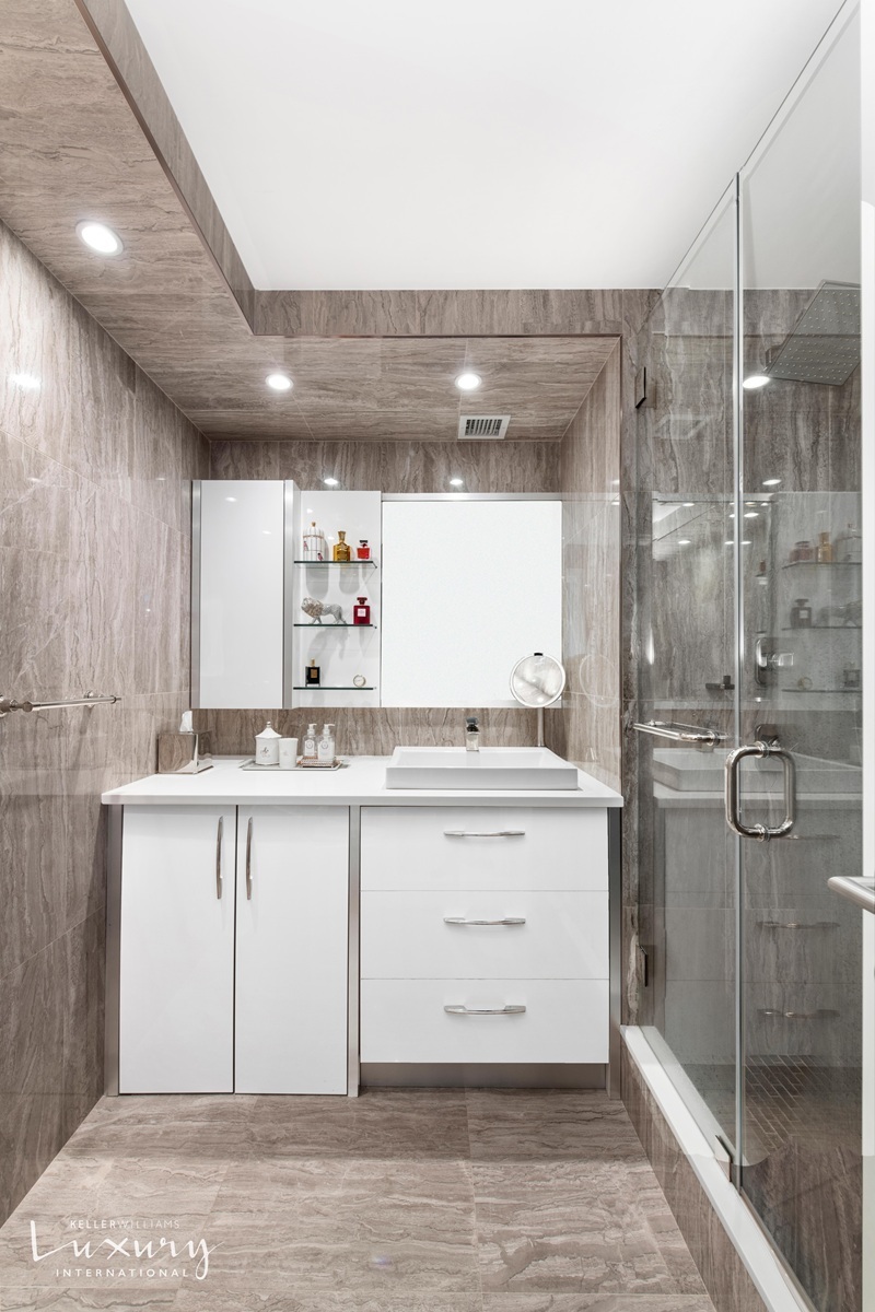 Undisclosed Address Manhattan, NY 10022 - Photo 12 of 16 a bathroom with a shower sink and mirror