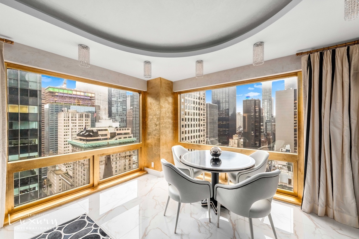 Undisclosed Address Manhattan, NY 10022 - Photo 4 of 16 a dining room with furniture a chandelier and wooden floor