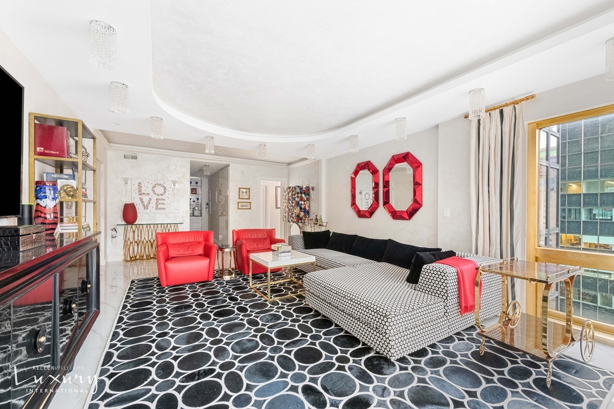 Undisclosed Address Manhattan, NY 10022 - Photo 6 of 16 a living room with furniture and a flat screen tv