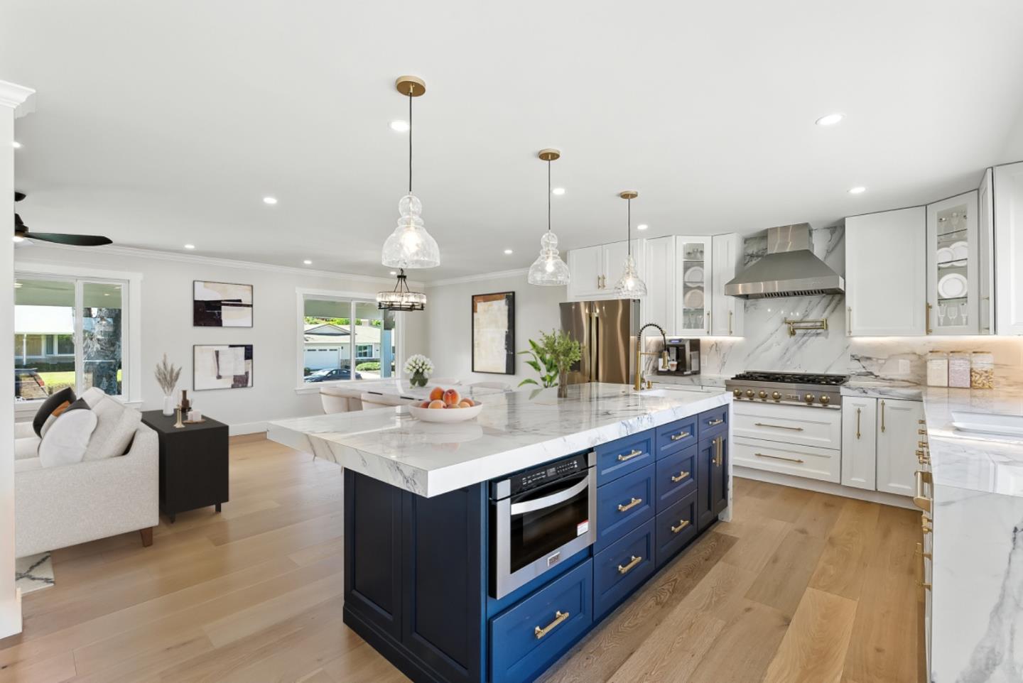 a kitchen with stainless steel appliances granite countertop a stove oven and a sink