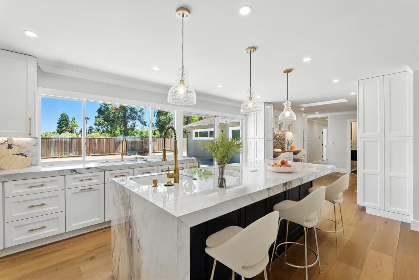 5701 Lewis Way Concord, CA 94521 - Photo 14 of 54 a dining hall with stainless steel appliances kitchen island granite countertop a table chairs and a view of living room