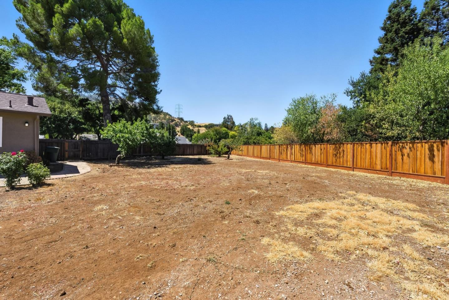 5701 Lewis Way Concord, CA 94521 - Photo 42 of 54 a view of backyard with wooden fence