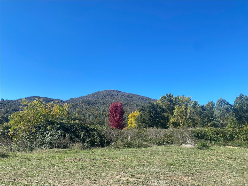 11255 Rancheria Road Upper Lake, CA 95485 - Photo 25 of 46 a view of a lake with a mountain in the background