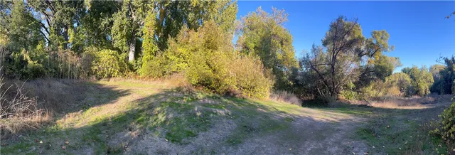 a view of a yard with an outdoor and a fire pit