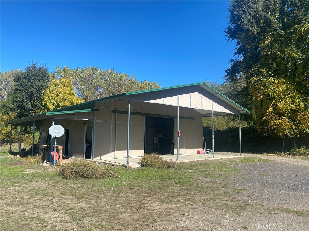 11255 Rancheria Road Upper Lake, CA 95485 - Photo 5 of 46 a view of a house with a backyard