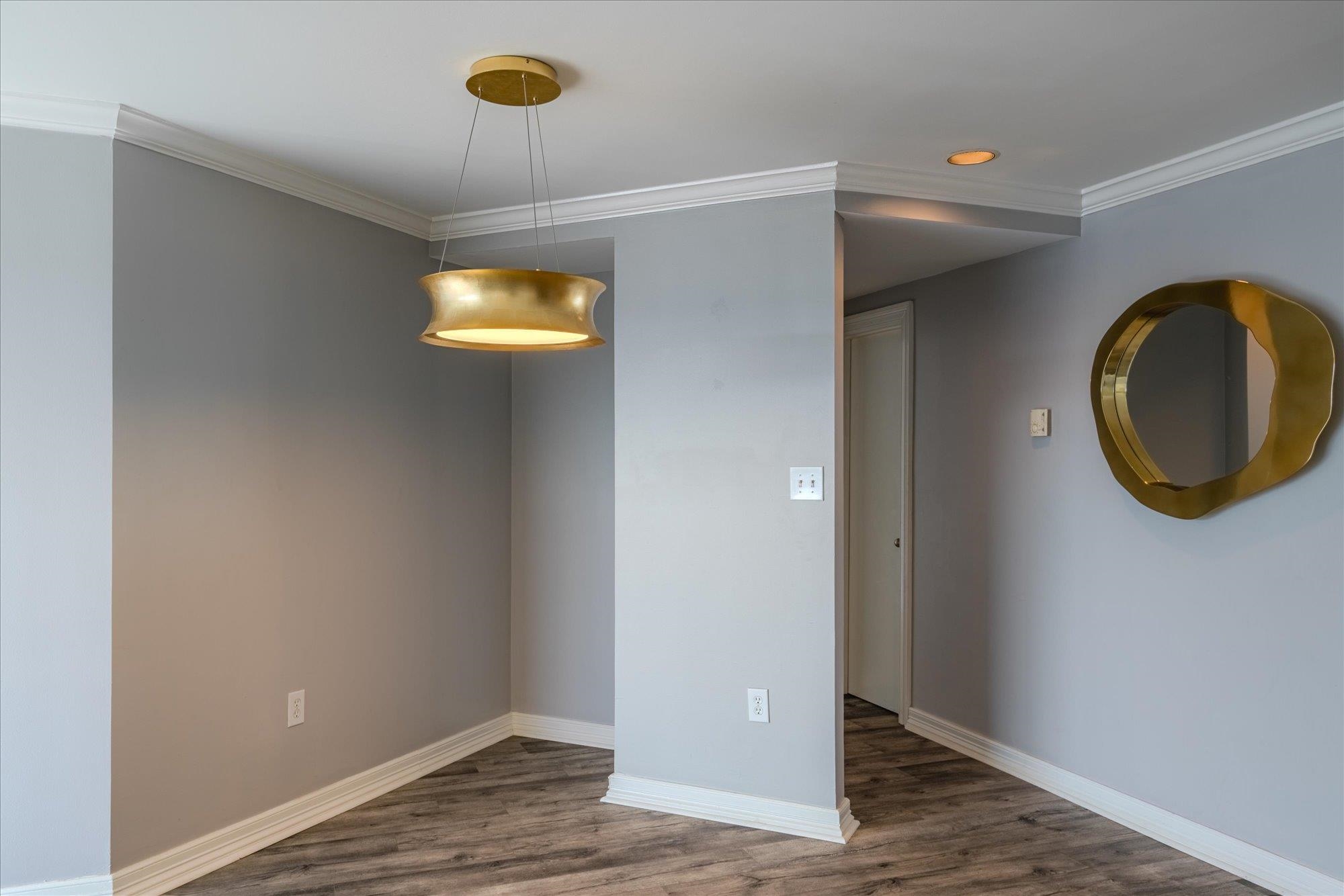 655 Riverside Drive, Unit 904B Memphis, TN 38103 - Photo 17 of 39 a view of a livingroom with wooden floor and a window