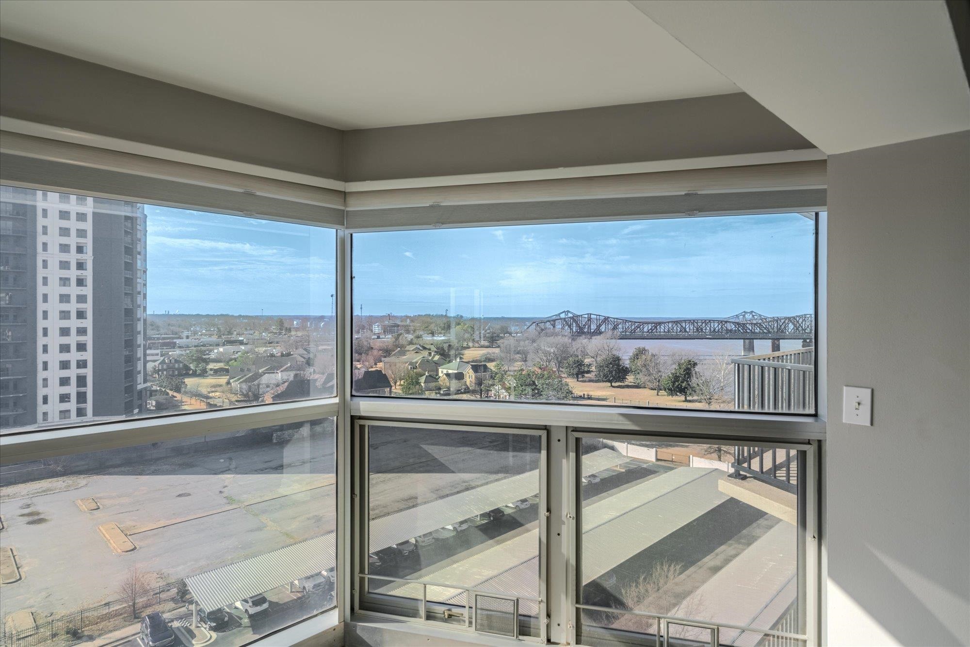655 Riverside Drive, Unit 904B Memphis, TN 38103 - Photo 25 of 39 a view of a glass door with a balcony from a window