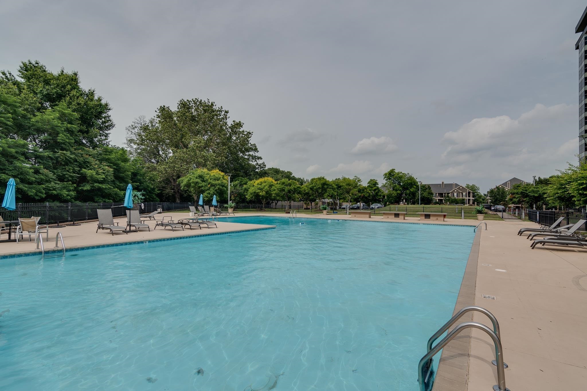 655 Riverside Drive, Unit 904B Memphis, TN 38103 - Photo 29 of 39 a view of a swimming pool and a yard