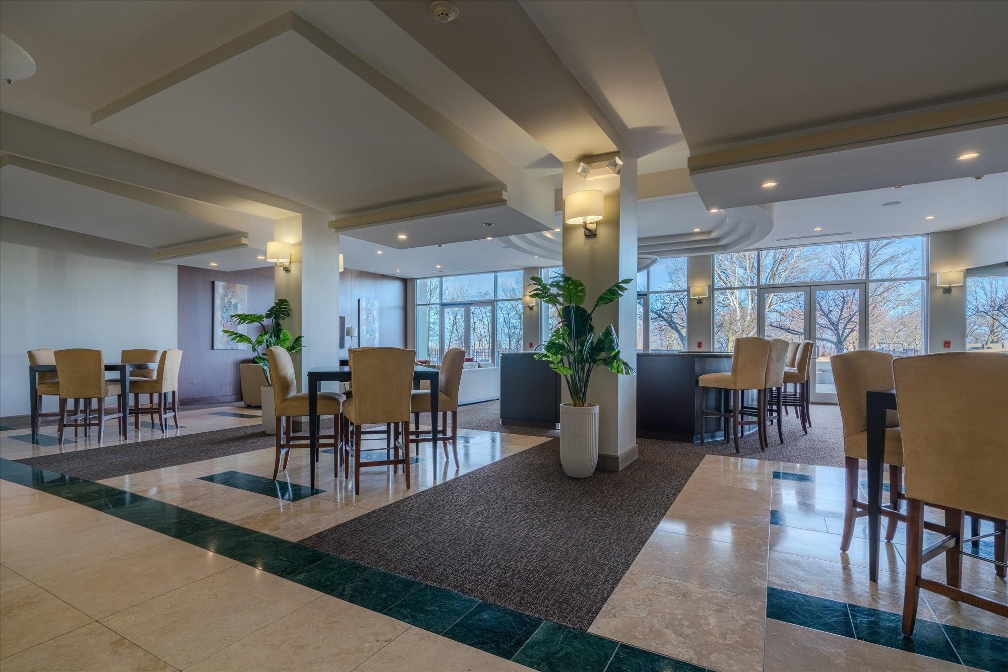 655 Riverside Drive, Unit 904B Memphis, TN 38103 - Photo 33 of 39 a view of a dining room with furniture window and wooden floor