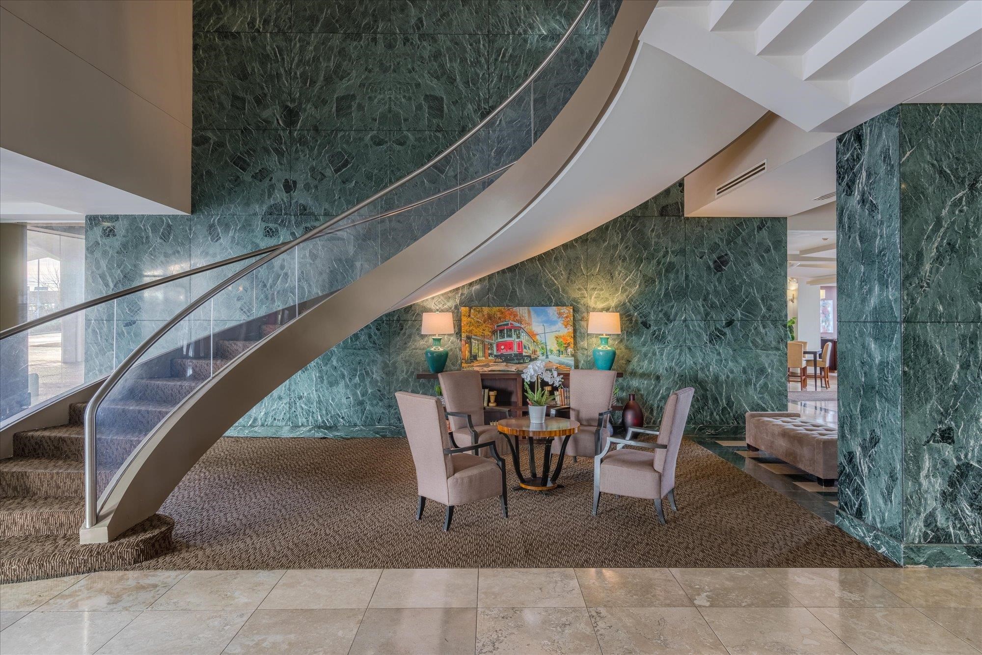 655 Riverside Drive, Unit 904B Memphis, TN 38103 - Photo 34 of 39 a view of a patio with table and chairs and potted plants
