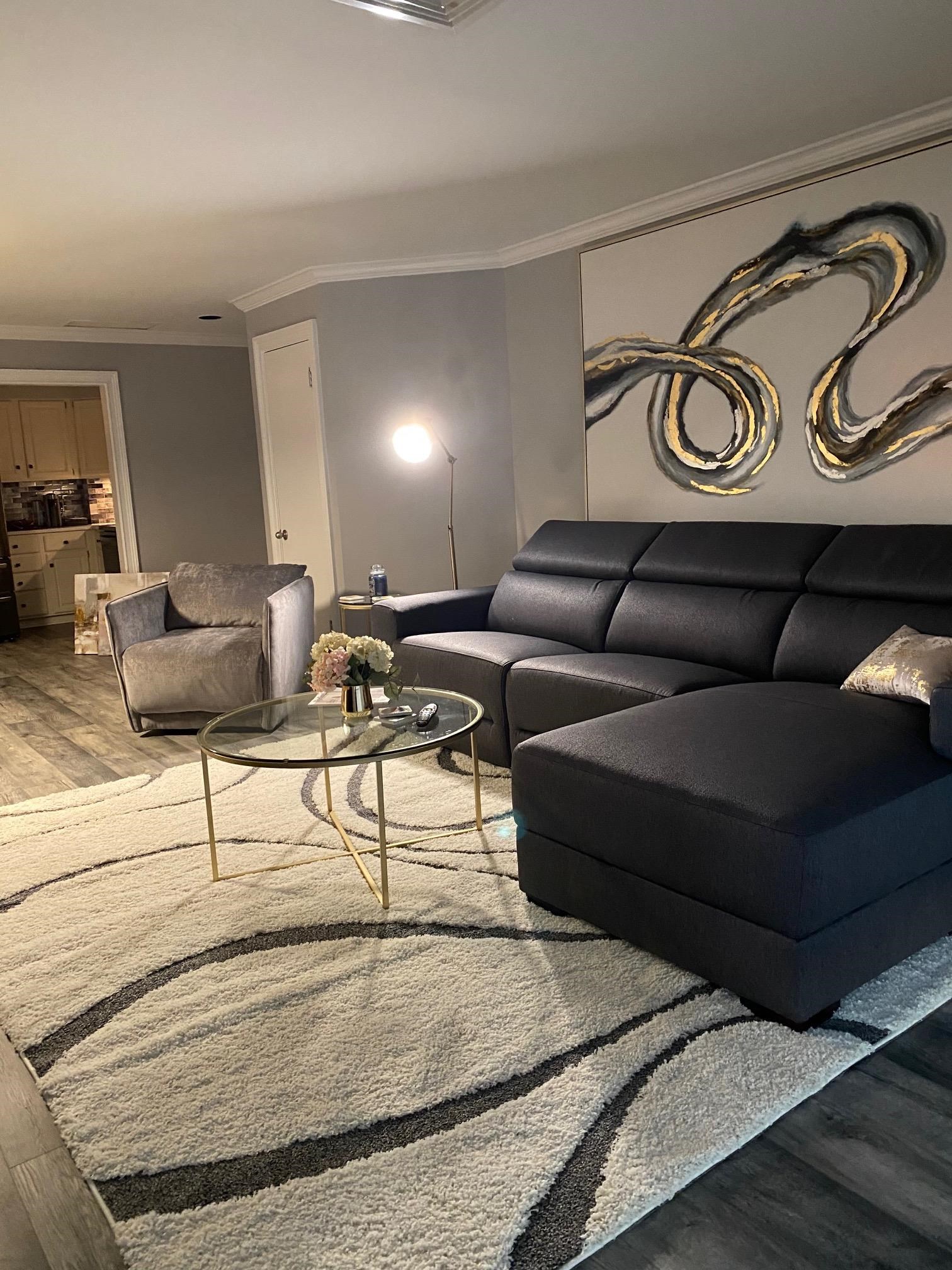 655 Riverside Drive, Unit 904B Memphis, TN 38103 - Photo 38 of 39 a living room with furniture and a wooden floor