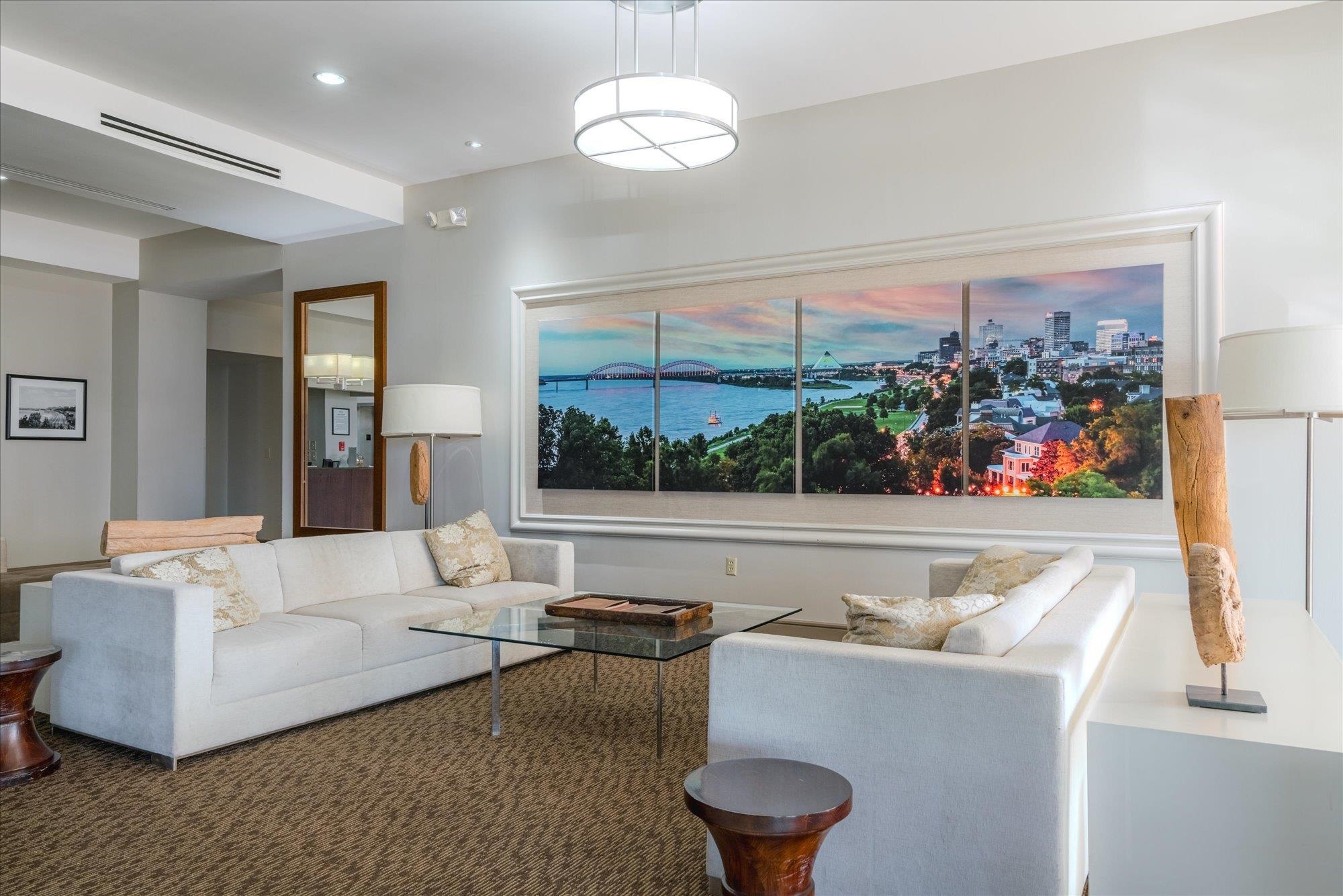 655 Riverside Drive, Unit 904B Memphis, TN 38103 - Photo 4 of 39 a living room with furniture and a large window