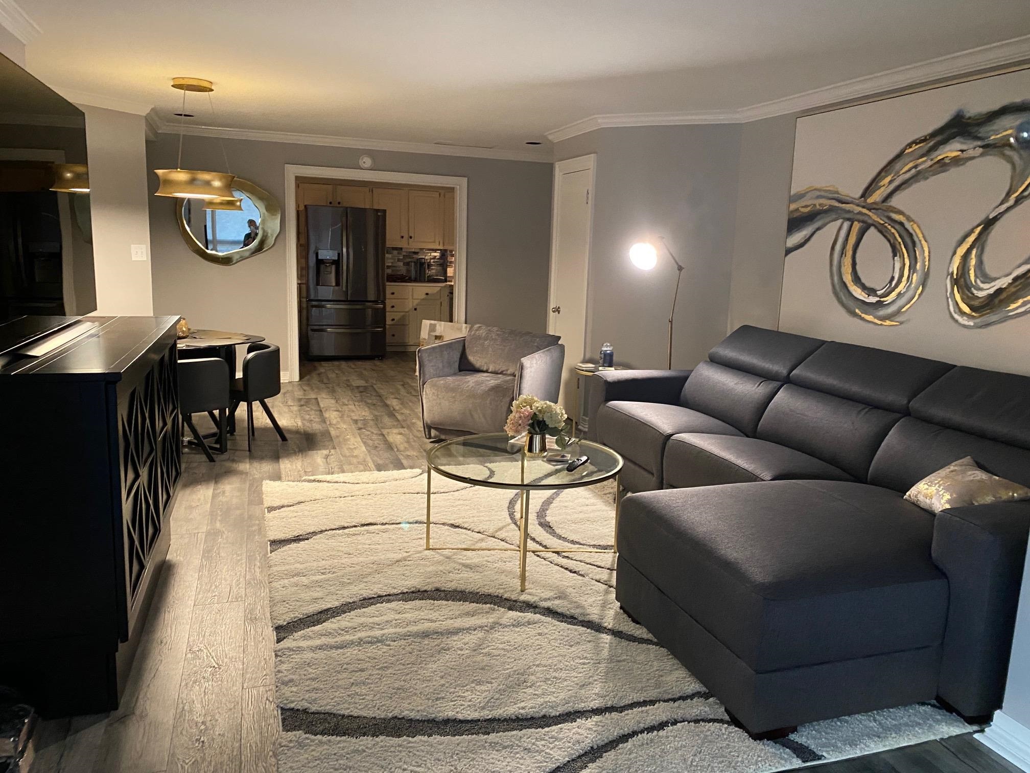 655 Riverside Drive, Unit 904B Memphis, TN 38103 - Photo 8 of 39 a living room with furniture and a large window