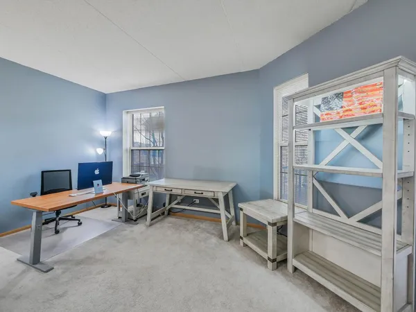 a bedroom with furniture and a window