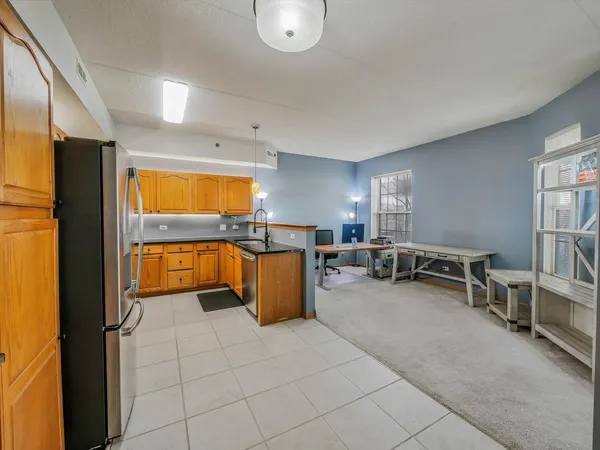 a view of kitchen and dining area with furniture