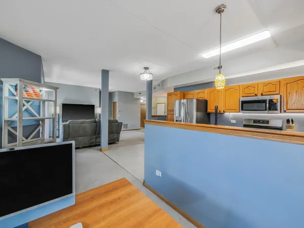 a view of a kitchen with furniture and a fireplace