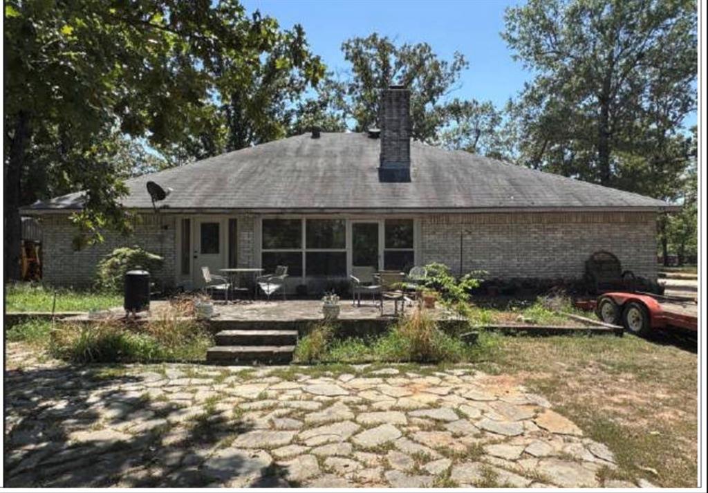 4415 Smallwood Road Reno, TX 75462 - Photo 2 of 39 a front view of a house with garden